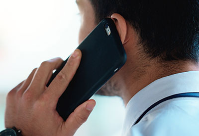 Businessman talking on phone - Castle Property Services - Builders and Property Specialists in Newcastle-under-Lyme Staffordshire