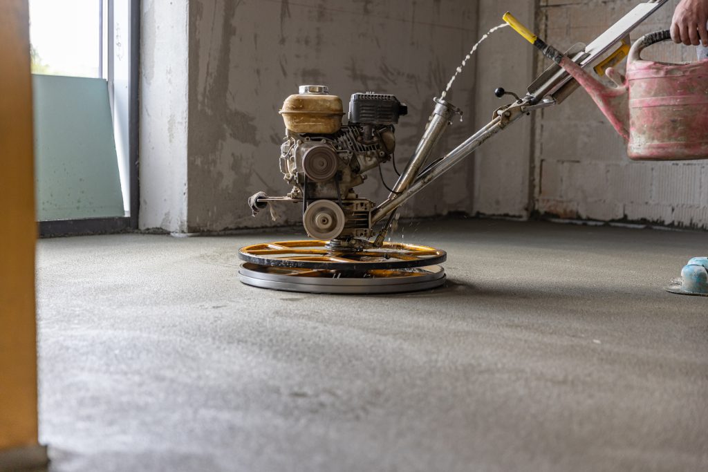Polishing sand and cement screed floor - red ash removal in Newcastle Staffordshire
